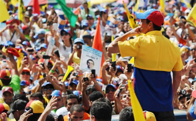 Venezuelan presidential candidate Henrique Capriles Radonsky blows a kiss to the crowd attending his campaign meeting in Caracas on Sunday. Photo: EPA