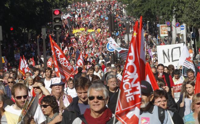 Demonstrators march during a rally to protest against the austerity measures announced by the French government, in Paris, on Sunday. Photo: AP