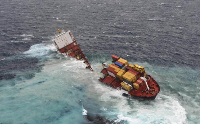 Stranded cargo ship Rena breaks in two pieces after being pounded by waves six metres high off New Zealand''s North Island. Photo: AP