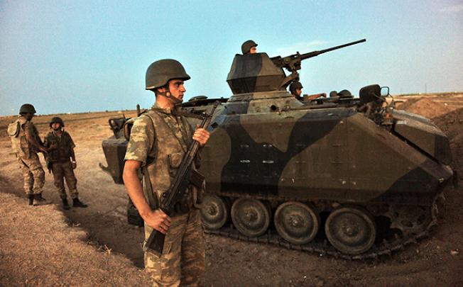 Turkish soldiers guard the Syrian border at Akcakale, Sanliurfa province. Photo: AFP