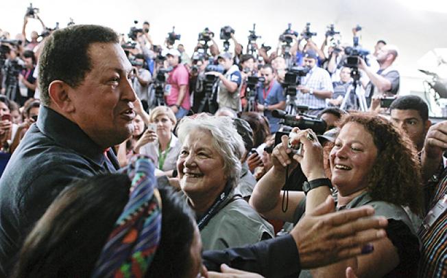 Venezuelan President Hugo Chavez with supporters in Caracas on Sunday. Photo: AFP