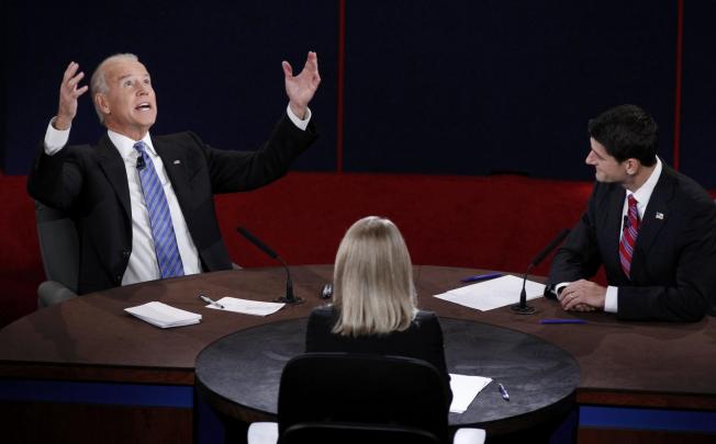Vice-President Joe Biden raises his arms and looks to the heavens as he hammers home a point of view in the debate with Mitt Romney's nominee Paul Ryan. Photo: Reuters