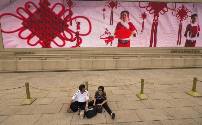 Sparse National Day decorations in Tiananmen Square this year. Photo: EPA