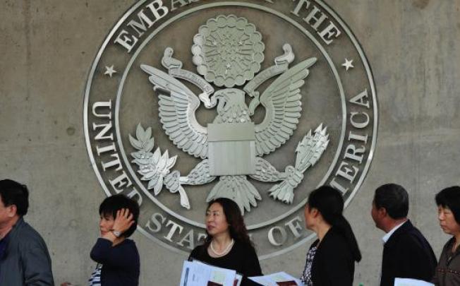 Chinese citizens in line to submitt US visa application outside the U.S. Embassy in Beijing. Photo: AFP  