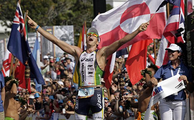 Australia’s Pete Jacobs celebrates his Ironman win on Saturday. Photo: AP