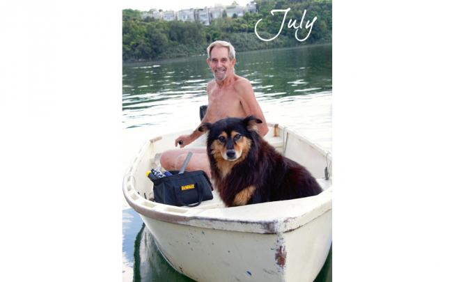 Peter Hansen posed with his strategically placed dog Lassie in his boat for July. Photo: Red Door News
