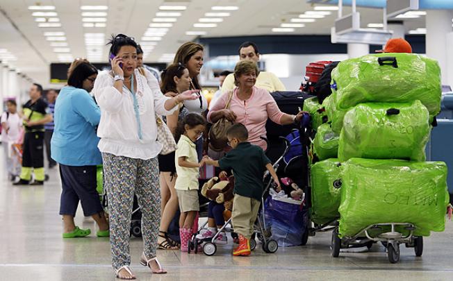 Passengers at Miami airport wait for a flight to Havana. Photo: AP