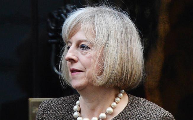 British Home Secretary Theresa May leaves 10 Downing street in central London on Tuesday. Photo: AFP