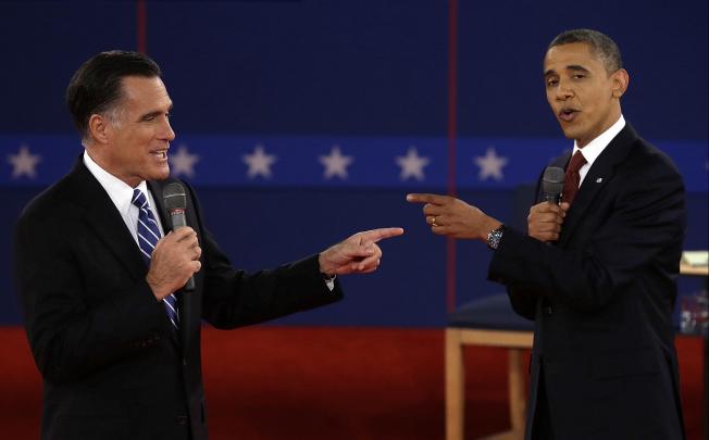 Mitt Romney and Barack Obama trade accusations during the second US presidential debate held at Hofstra University in New York. Photo: AP 