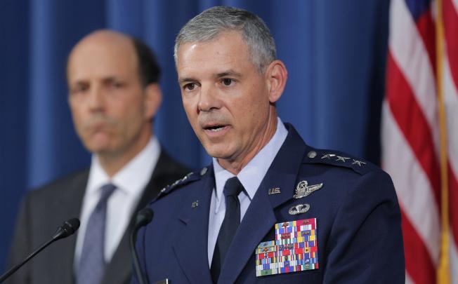 Commander of US Forces in Japan Lieutenant General Salvatore Angelella speaks to the media next to US Ambassador John Roos on Friday. Photo: AP
