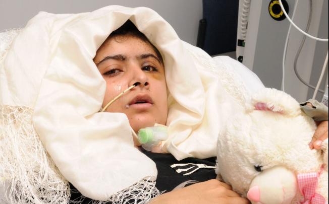 Pakistani schoolgirl Malala Yousafzai lying in her bed after receiving treatment at the Queen Elizabeth Hospital/University Hospitals in Birmingham on October 19, 2012. Photo: AFP