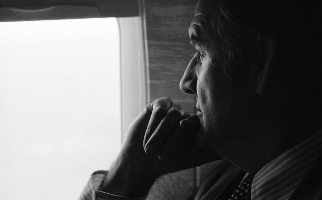 George McGovern looks out of plane window while campaigning in 1974. Photo: AP
