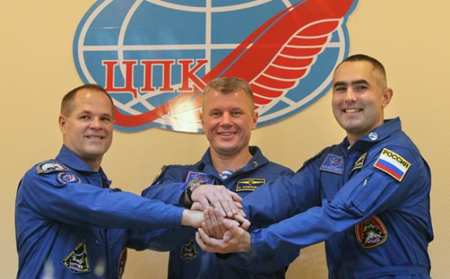 Nasa astronaut Kevin Ford (left) and Russian cosmonauts Oleg Novitsky (centre) and Yevgeny Tarelkin at the Cosmodrome Baikonur on October 22. Photo: EPA