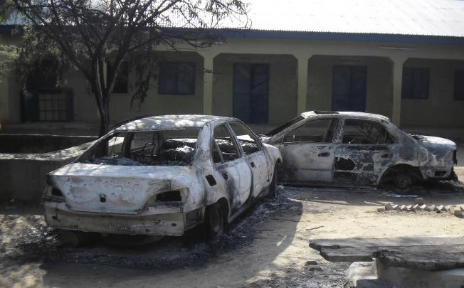 Burnt out cars in Potiskum, the commercial hub of Yobe state, which has been hit hard by near daily Islamist attacks in recent weeks. Photo: AP