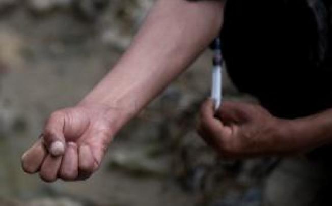 Shooting galleries would provide sterile needles and medical oversight for drug injectors. File photo: AFP