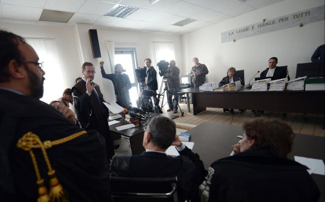 A lawyer (centre) addresses the court in charge of the trial of six Italian scientists and a government official charged with manslaughter for underestimating the 2009 earthquake in L'Aquila, Italy. Photo: AFP