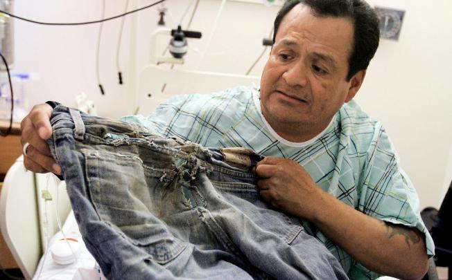 Ricky Gilmore, pictured with the jeans he was wearing. Photo: AP