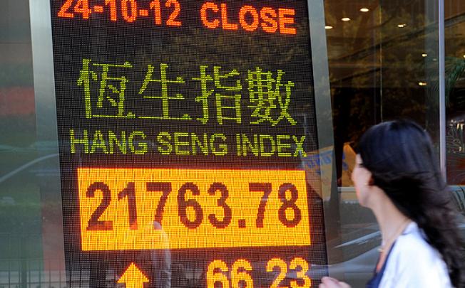 A bank board shows the Hang Seng Index close in Central. Photo: Xinhua