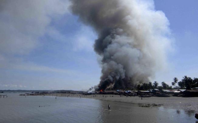 A fire burns in the Pike Sake quarter in Kyout Phyu, Rakhine state, western Myanmar, on Wednesday. Photo: EPA
