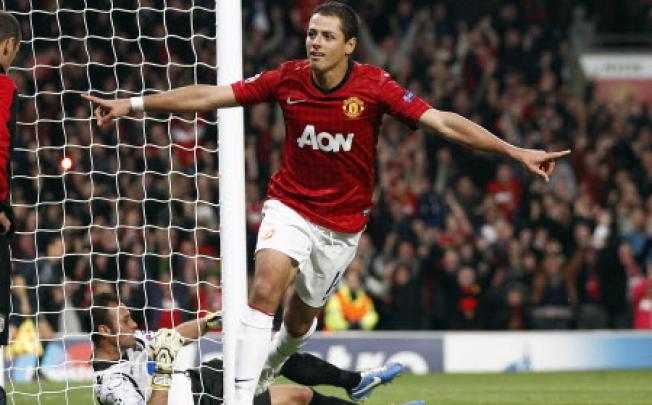 Manchester United's Javier Hernandez celebrates after he scores the third goal during their Champions League Group H soccer match against SC Braga in Manchester on Tuesday. Photo: AP