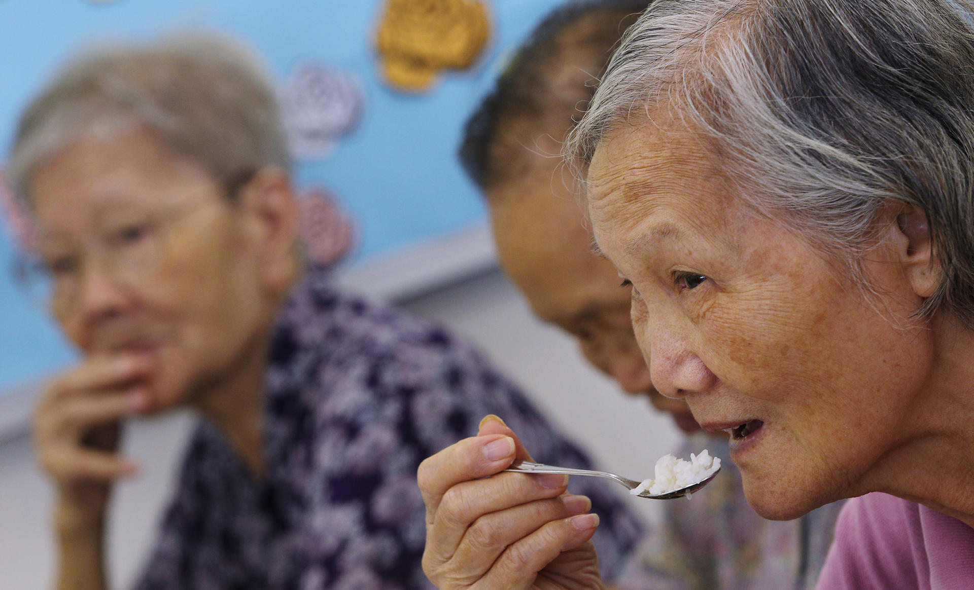 Elderly people receive a free meal from People's Food Bank. Photos: K.Y. Cheng, Nora Tam, Thomas Yau