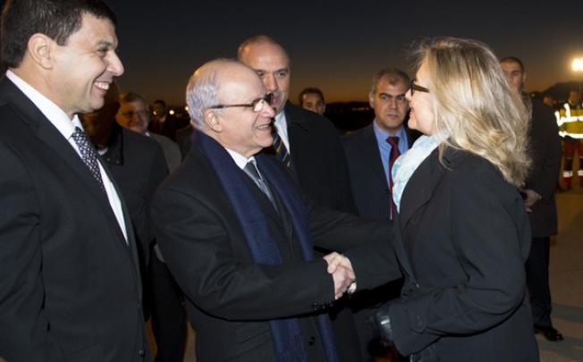 Algerian Foreign Minister Mourad Medelci (centre) greets US Secretary of State Hillary Clinton at Houari Boumediene Airport in Algiers on Monday. Photo: AFP