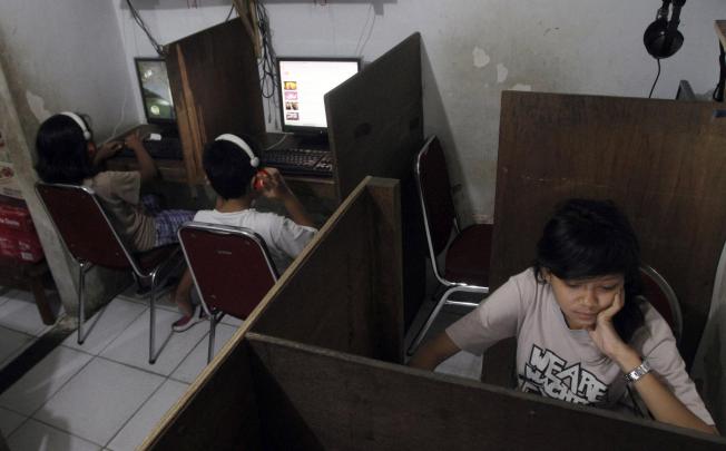 Many young Indonesians using Facebook are unaware of the dangers of allowing strangers to see their personal information online. Photo: AP