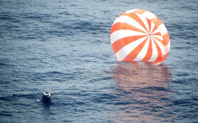 The unmanned Dragon capsule during its splashdown a few hundred kilometres off the Baja California coast. Photo: AP