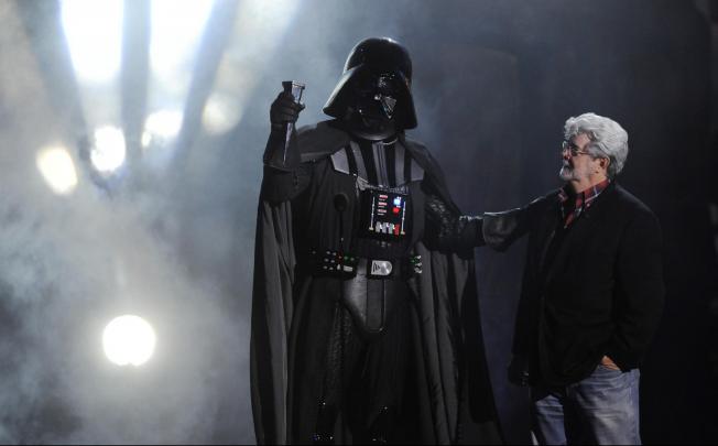 George Lucas with his most infamous creation, Darth Vader, now a Disney character alongside Snow White. Photo: AP