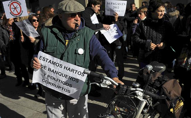 People demonstrate against the government cuts in Pamplona, northern Spain. Photo: AP