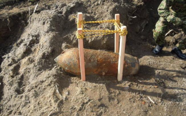 A huge unexploded wartime bomb found at a construction site near the runway of Sendai Airport in Japan. Photo: AFP