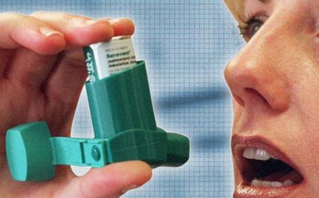 A woman using an inhaler to deal treat her asthma. Almost a third of women stop using asthma medications during the first few months of pregnancy, a new study shows.  Photo: AP