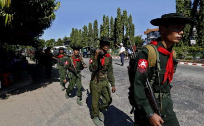 Myanmar soldiers, arriving back from the unrest area in Rakhine state, march in Sittwe city, capital of Rakhine State, Myanmar. Photo: EPA