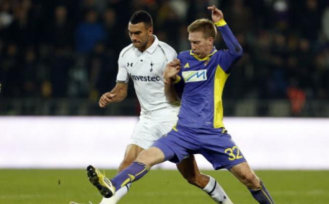 Tottenham's Steven Caulker (left) being challenged by Maribor's Robert Beric. Caulker and Thomas Ince have reportedly been charged by Serbian police for their role in an on-field brawl. Photo: AP