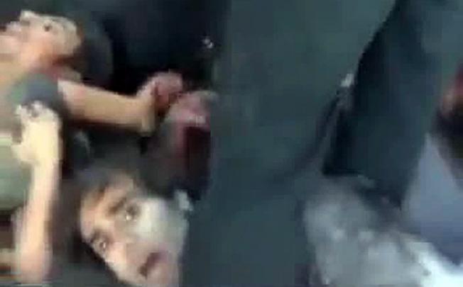 A YouTube video shows Syrian rebels kicking and executing their prisoners after they forced them to lie down at the Hamisho checkpoint near Saraqeb. Photo: AFP