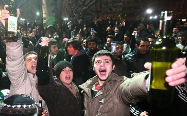 Turkish young people raise their glasses of beer as they party in dowtown Ankara. Photo: AFP