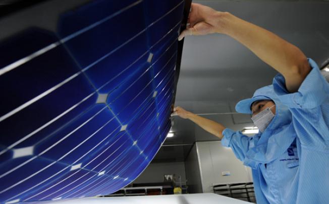 A worker produces solar module, for export to Europe, at a company in Taizhou City, east China's Zhejiang province. Photo: Xinhua