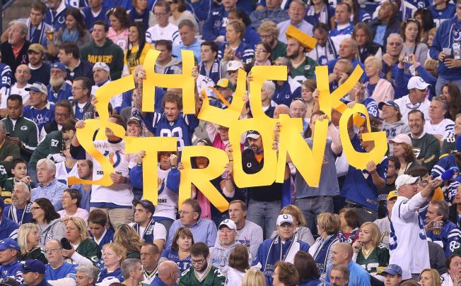 Indianapolis Colts fans hold up a sign to show their support for head coach Chuck Pagano.