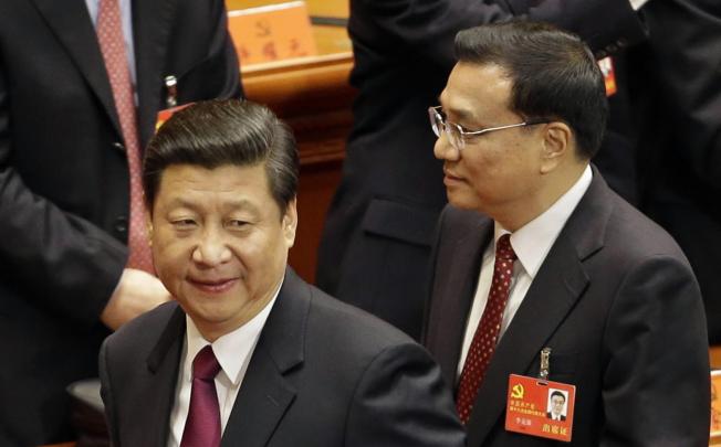 Xi Jinping (left) and Li Keqiang at the 18th party congress. Photo: AP