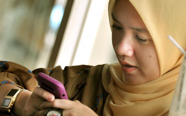 In the Philippines and Indonesia, women are increasingly using social media technology to expand their opportunities in business and politics. Photo: AFP