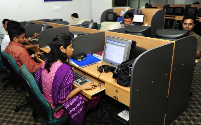Programmers at work in a software firm in Dhaka, Bangladesh. Upgrading the service sector could play a critical role in the future growth of Asia. Photo: AFP