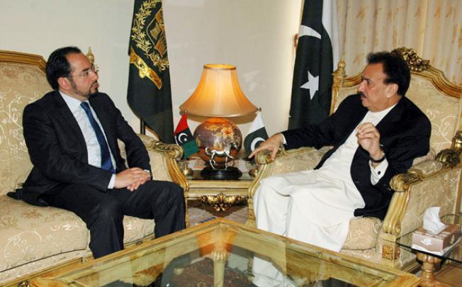 Pakistan's Interior Minister Rehman Malik (right) meets with Salahuddin Rabbani, head of Afghanistan High Peace Council, in Islamabad on Wednesday. Photo: AP 
