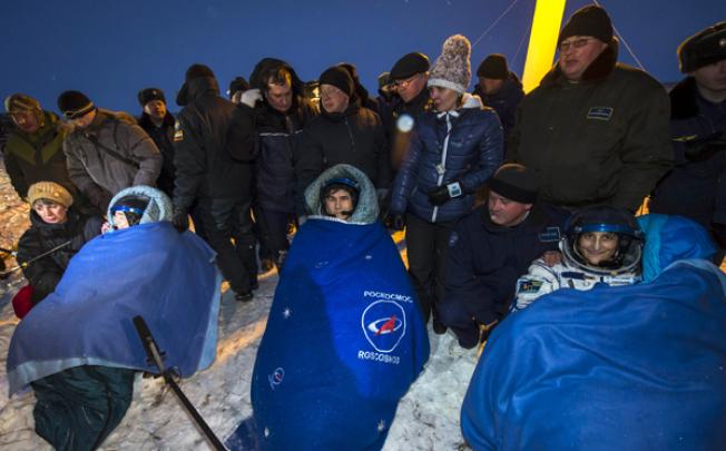 Expedition 33 Commander Sunita Williams (right) and Flight Engineers Yuri Malenchenko and Akihiko Hoshide (left) sit in chairs outside the Soyuz Capsule just minutes after landing on Monday. Photo: AFP/Nasa/Bill Ingalls 