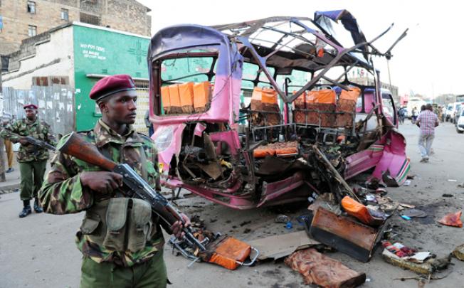 A solider stands guard at the site of a traffic accident in Nairobi, Kenya, on Sunday. Photo: Xinhua