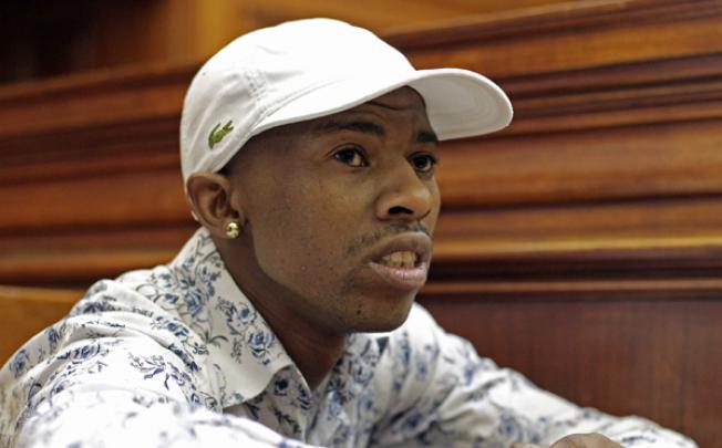 Xolile Mngeni sits in the dock in Cape Town, South Africa, on Monday, as he awaits the court's verdict. Photo: AP