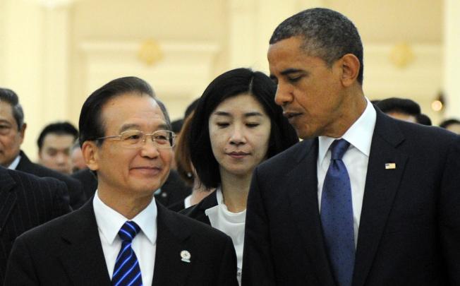 US President Barack Obama (right) talks to Chinese Premier Wen Jiabao at the East Asia Summit in Phnom Penh. With domestic politics now out the way, China and the US have shifted their attention back to the Asean geopolitical chessboard. Photo: AFP
