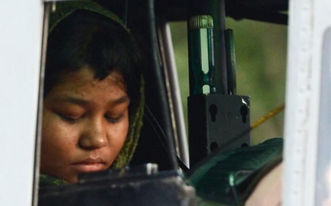 Rimsha Masih, a Christian girl accused of blasphemy, sits in helicopter after her release from jail in Rawalpindi on September 8. Photo: AFP