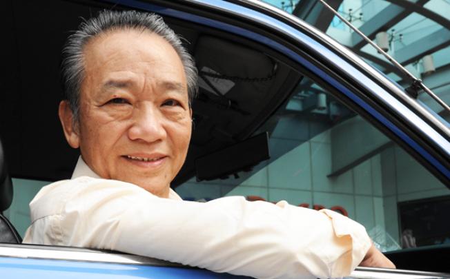 Singapore cab driver Sia Ka Tian sits in his taxi. Photo: AFP