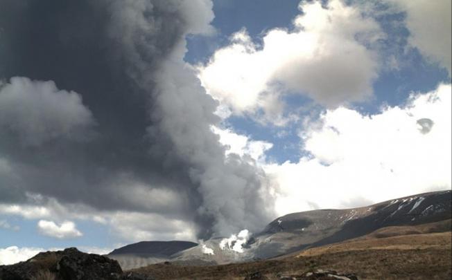 Dark ash billows from the volcano yesterday. Photo: AFP