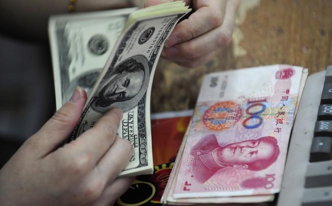 The world might drift towards a multiple reserve-currency system shared among the dollar, the euro and - sometime in the future - the renminbi. Photo: AFP